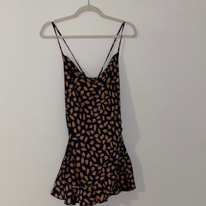 Navy blue and orange spotted romper